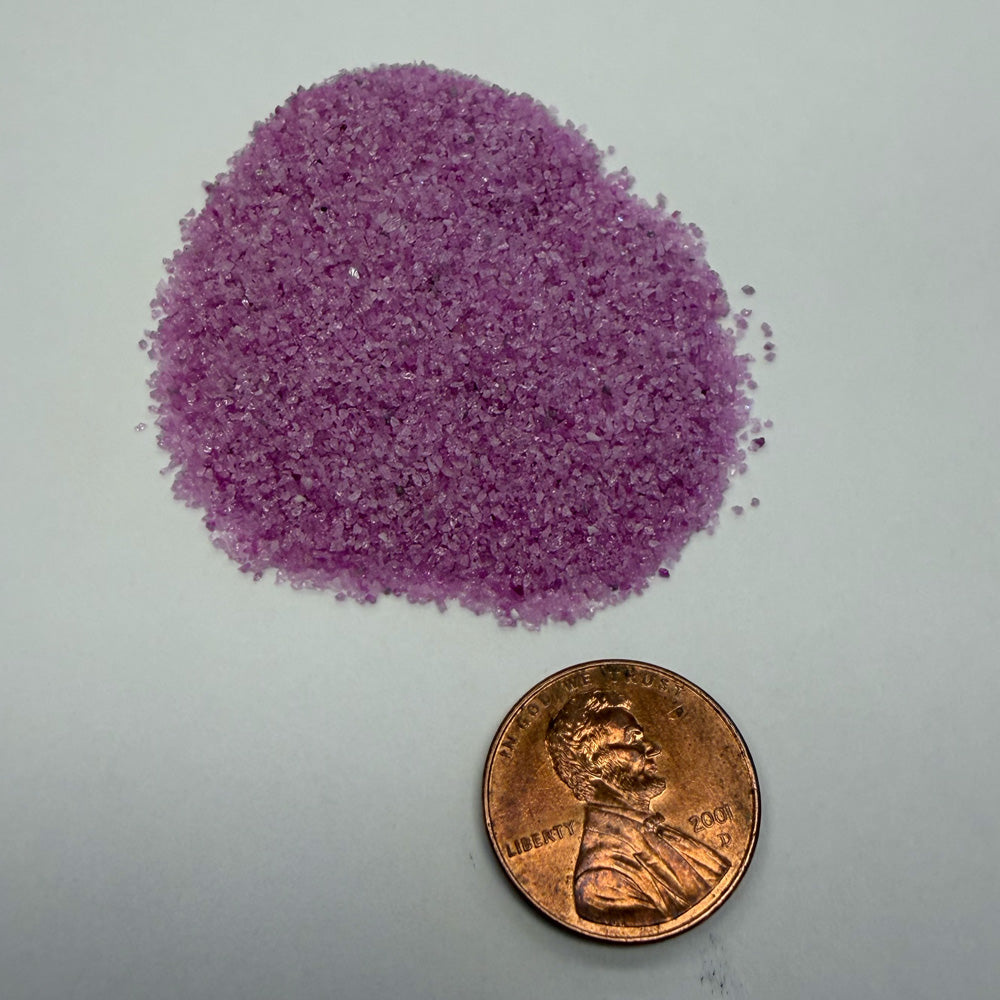 Small pile of B-ALOX P36 midi edge-prep media shown with a penny for size comparision