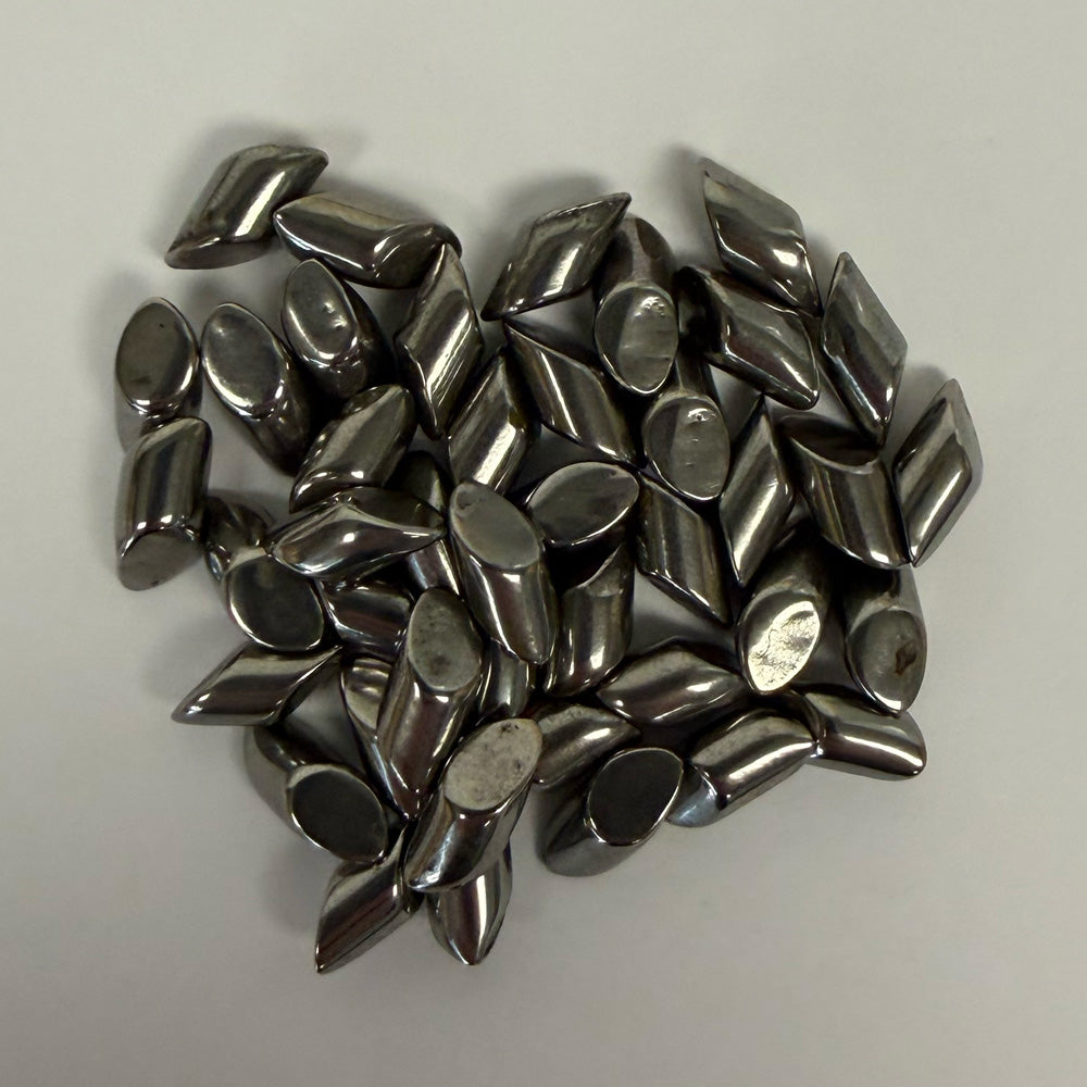 Small pile close-up of SC-DIAGONALS 3/16 inch carbon steel media