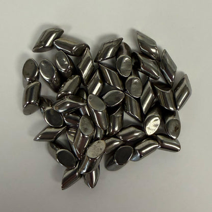Small pile close-up of SC-DIAGONALS 3/16 inch carbon steel media