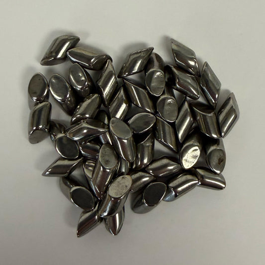 Small pile close-up of SC-DIAGONALS 3/16 inch carbon steel media
